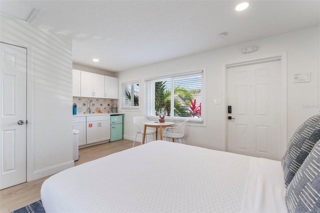 402 S Orlando Ave, Cocoa Beach, FL 32931 - bedroom featuring light wood finished floors and recessed lighting