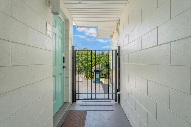402 S Orlando Ave, Cocoa Beach, FL 32931 - entrance to property featuring concrete block siding and a gate