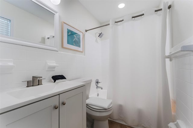 402 S Orlando Ave, Cocoa Beach, FL 32931 - full bathroom with shower / tub combo with curtain, tile walls, vanity, and decorative backsplash