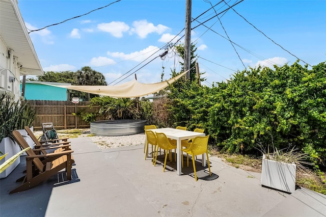 402 S Orlando Ave, Cocoa Beach, FL 32931 - view of patio featuring outdoor dining space and a jacuzzi
