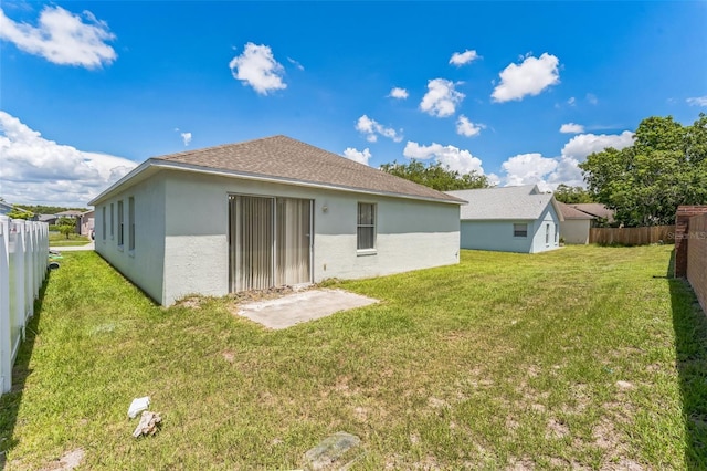 2110 Mallard Creek Cir, Kissimmee, FL 34743 - back of property featuring stucco siding