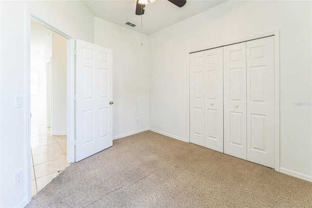 2110 Mallard Creek Cir, Kissimmee, FL 34743 - unfurnished bedroom with carpet flooring, a ceiling fan, and a closet