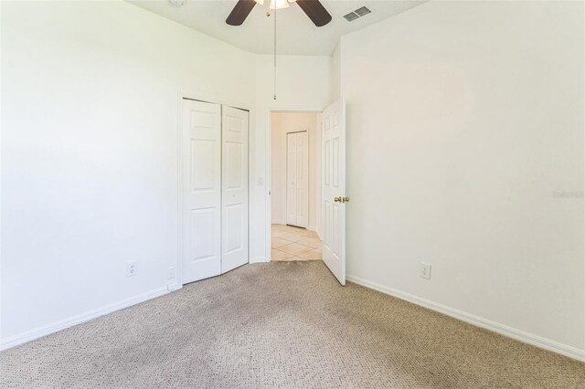 2110 Mallard Creek Cir, Kissimmee, FL 34743 - unfurnished bedroom with carpet flooring, ceiling fan, and a closet