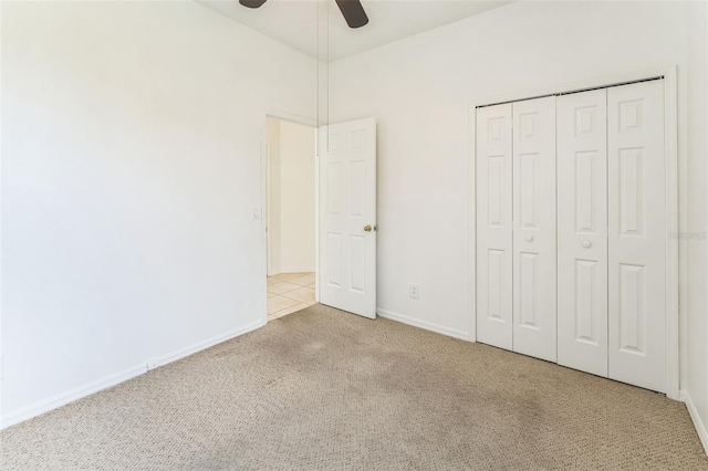 2110 Mallard Creek Cir, Kissimmee, FL 34743 - unfurnished bedroom with carpet, a closet, and ceiling fan