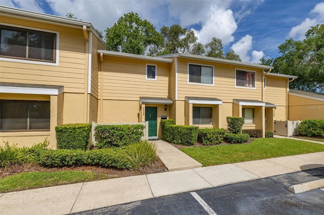 2208 Mcmahon Ct Unit 1033, Orlando, FL 32812 - multi unit property featuring a gate, stucco siding, and uncovered parking