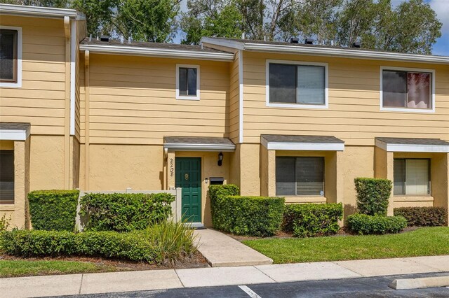 2208 Mcmahon Ct Unit 1033, Orlando, FL 32812 - view of property featuring stucco siding