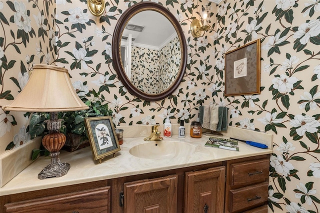 2208 Mcmahon Ct Unit 1033, Orlando, FL 32812 - bathroom with wallpapered walls, vanity, and ornamental molding