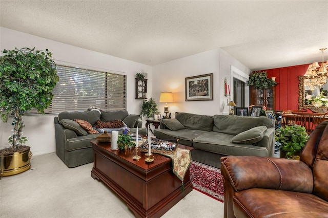 2208 Mcmahon Ct Unit 1033, Orlando, FL 32812 - living area featuring light carpet, a textured ceiling, and a chandelier