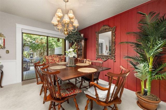 2208 Mcmahon Ct Unit 1033, Orlando, FL 32812 - dining space with a chandelier and light colored carpet