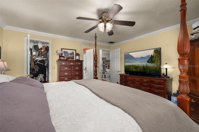 2208 Mcmahon Ct Unit 1033, Orlando, FL 32812 - bedroom with ornamental molding, a ceiling fan, a walk in closet, a closet, and a textured ceiling