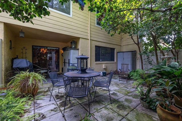 2208 Mcmahon Ct Unit 1033, Orlando, FL 32812 - view of patio / terrace featuring outdoor dining area and grilling area