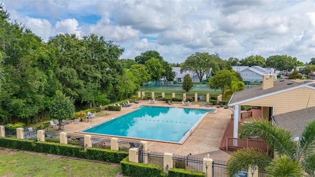 2208 Mcmahon Ct Unit 1033, Orlando, FL 32812 - community pool featuring a patio