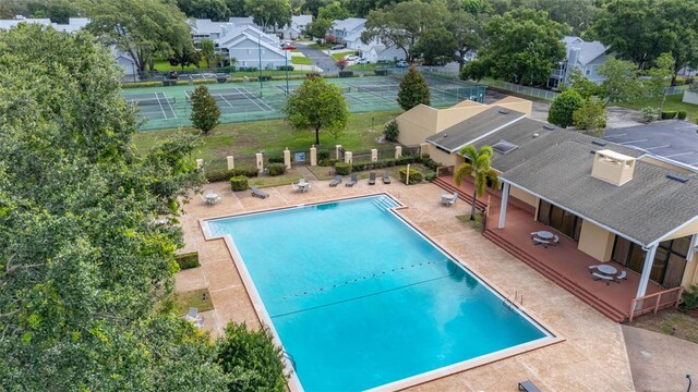 2208 Mcmahon Ct Unit 1033, Orlando, FL 32812 - community pool featuring a patio and a residential view