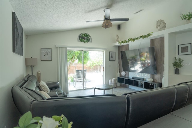 11761 Hatcher Cir, Orlando, FL 32824 - living room featuring lofted ceiling, ceiling fan, and a textured ceiling