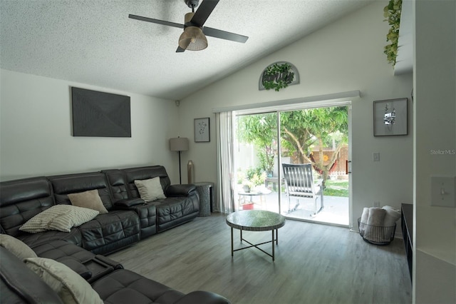 11761 Hatcher Cir, Orlando, FL 32824 - living area with vaulted ceiling, a ceiling fan, a textured ceiling, and wood finished floors
