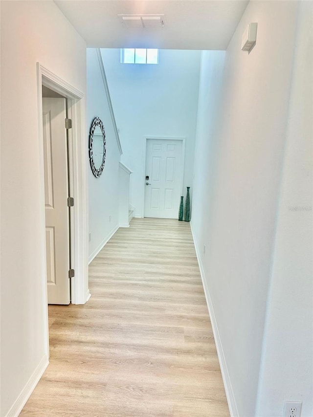 9937 Aqua Miles Path, Wesley Chapel, FL 33545 - hallway with light wood finished floors and stairs