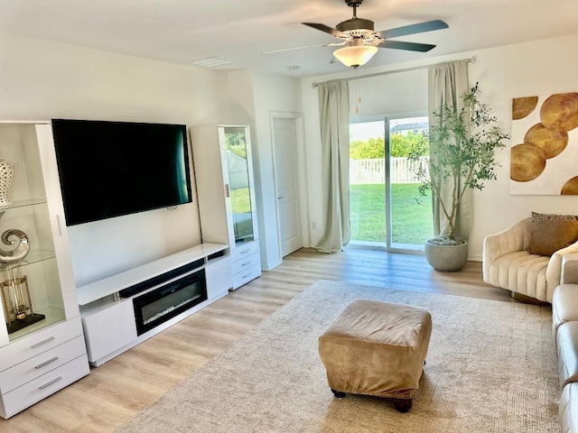 9937 Aqua Miles Path, Wesley Chapel, FL 33545 - living room featuring light wood-style floors and ceiling fan