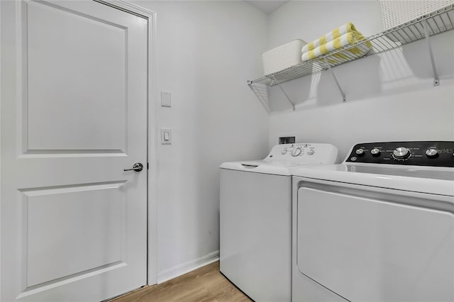 9937 Aqua Miles Path, Wesley Chapel, FL 33545 - laundry area with independent washer and dryer and light wood-style flooring