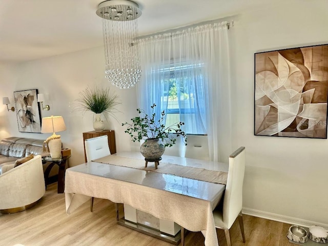 9937 Aqua Miles Path, Wesley Chapel, FL 33545 - dining space featuring wood finished floors and baseboards