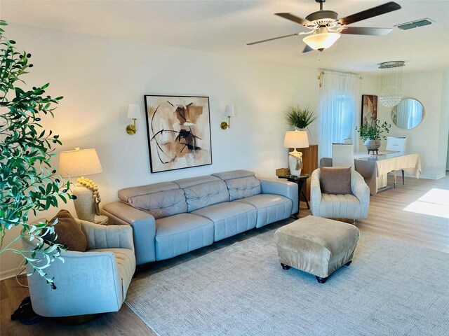 9937 Aqua Miles Path, Wesley Chapel, FL 33545 - living area featuring wood finished floors and ceiling fan