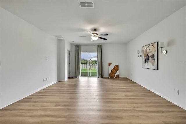 9937 Aqua Miles Path, Wesley Chapel, FL 33545 - empty room with a ceiling fan and light wood finished floors