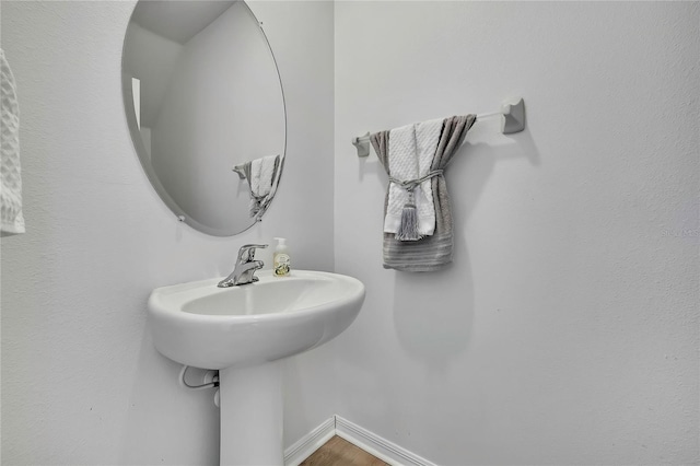 9937 Aqua Miles Path, Wesley Chapel, FL 33545 - bathroom with wood finished floors and baseboards