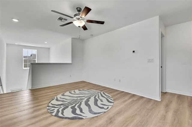 9937 Aqua Miles Path, Wesley Chapel, FL 33545 - unfurnished room with a ceiling fan, wood finished floors, and recessed lighting