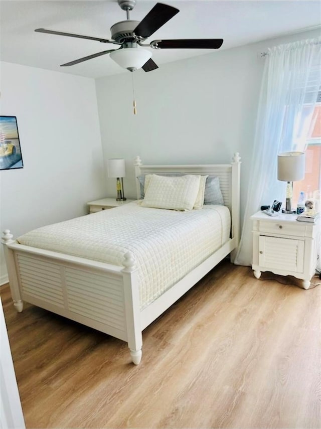 9937 Aqua Miles Path, Wesley Chapel, FL 33545 - bedroom with light wood-style flooring and a ceiling fan