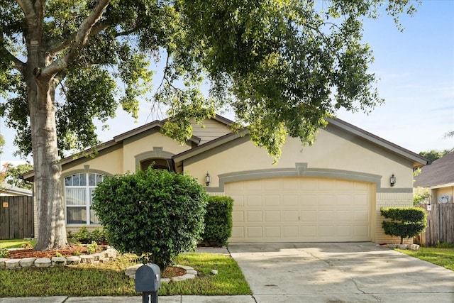 1716 Westerly Dr, Brandon, FL 33511 - view of front of property featuring a garage, driveway, and stucco siding