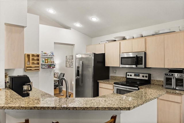 1716 Westerly Dr, Brandon, FL 33511 - kitchen with appliances with stainless steel finishes, light brown cabinetry, a peninsula, light stone counters, and recessed lighting