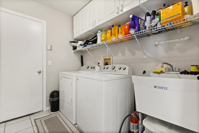 1716 Westerly Dr, Brandon, FL 33511 - washroom featuring cabinet space, separate washer and dryer, and light tile patterned flooring