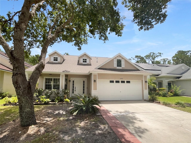 16006 Stags Leap Dr, Lutz, FL 33559 - view of front of property with a garage, stucco siding, driveway, and roof with shingles