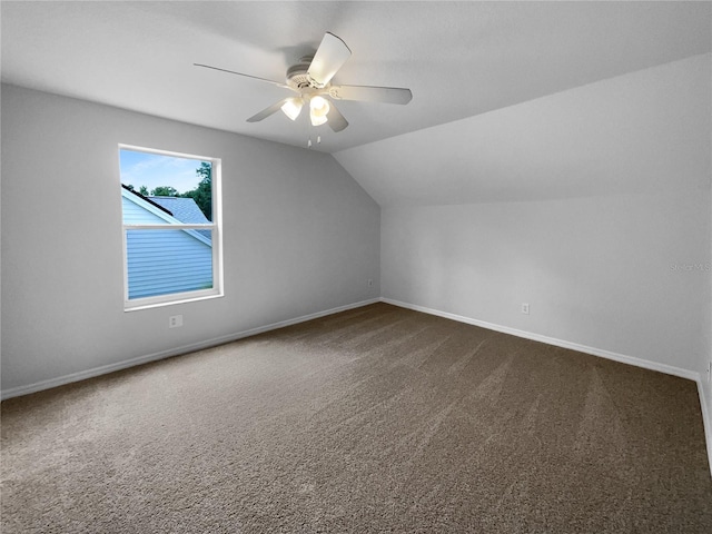 16006 Stags Leap Dr, Lutz, FL 33559 - additional living space featuring dark colored carpet, vaulted ceiling, and a ceiling fan