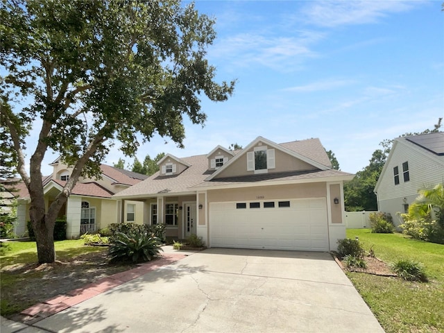 16006 Stags Leap Dr, Lutz, FL 33559 - view of front of property with stucco siding, driveway, an attached garage, and roof with shingles