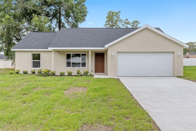 1059 NE 130th Ter, Silver Springs, FL 34488 - view of front of house featuring roof with shingles, stucco siding, driveway, a front lawn, and a garage