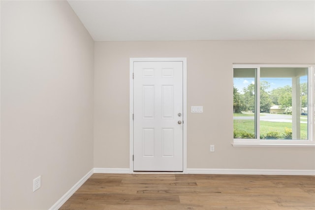 1059 NE 130th Ter, Silver Springs, FL 34488 - foyer entrance featuring light wood-style flooring and baseboards