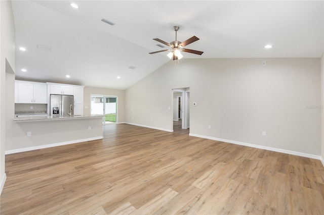 1059 NE 130th Ter, Silver Springs, FL 34488 - unfurnished living room featuring a ceiling fan, light wood finished floors, vaulted ceiling, and recessed lighting