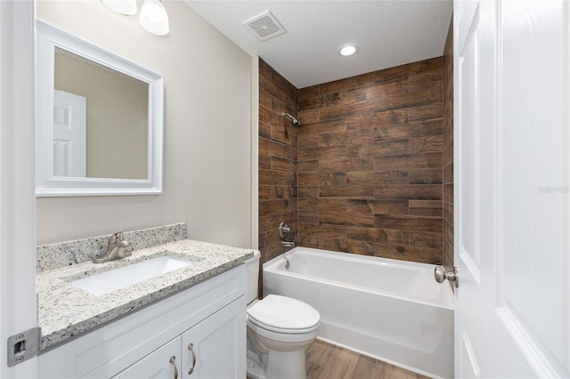 1059 NE 130th Ter, Silver Springs, FL 34488 - full bathroom with vanity, shower / bathtub combination, wood finished floors, and recessed lighting