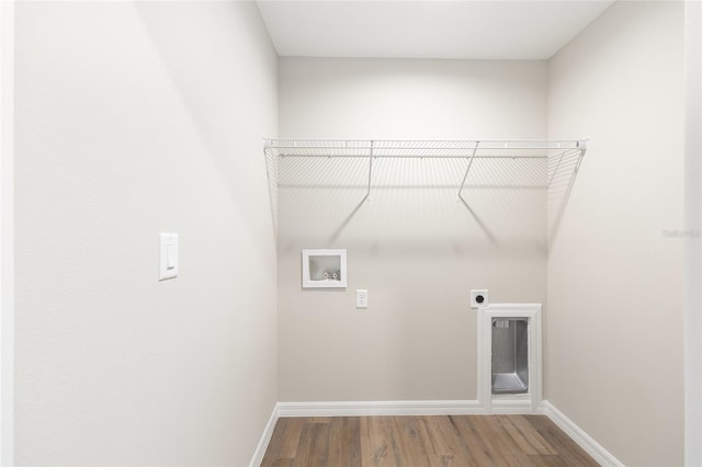 1059 NE 130th Ter, Silver Springs, FL 34488 - laundry area featuring washer hookup, hookup for an electric dryer, and wood finished floors