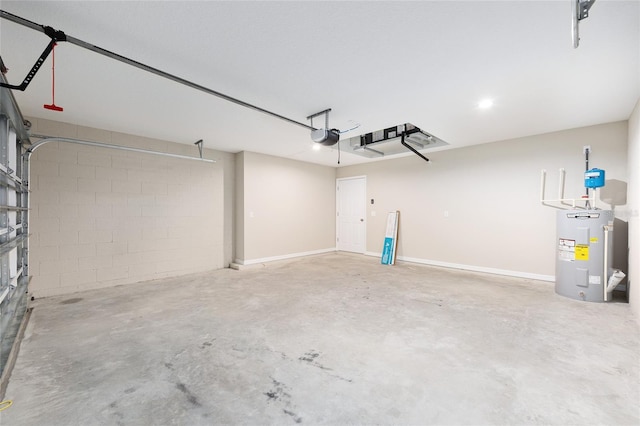 1059 NE 130th Ter, Silver Springs, FL 34488 - garage featuring water heater, a garage door opener, and concrete block wall