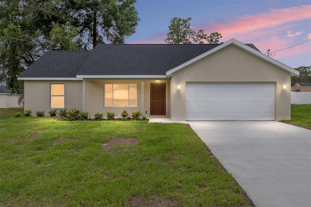 1059 NE 130th Ter, Silver Springs, FL 34488 - single story home featuring stucco siding, driveway, a garage, roof with shingles, and a lawn