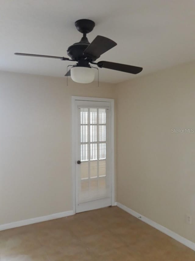 5725 Gatlin Ave Unit 315, Orlando, FL 32822 - empty room featuring a ceiling fan and baseboards
