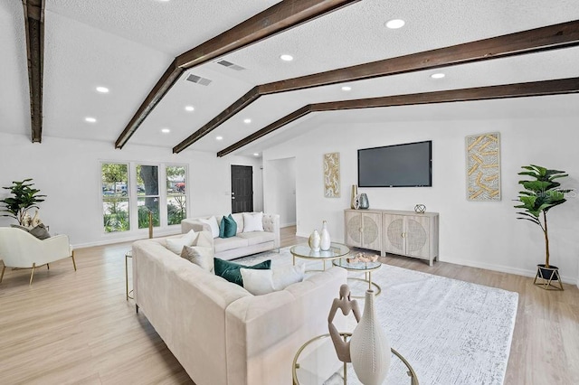 3029 Pinetree, Winter Haven, FL 33884 - living area with light wood finished floors, recessed lighting, and a textured ceiling
