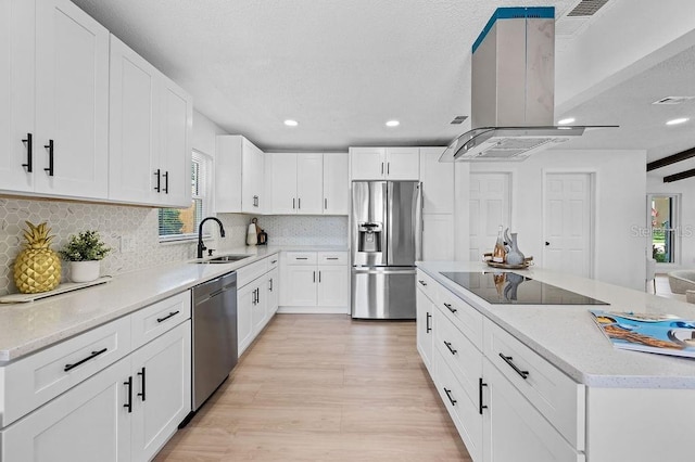 3029 Pinetree, Winter Haven, FL 33884 - kitchen with stainless steel appliances, island range hood, recessed lighting, tasteful backsplash, and light wood-style floors