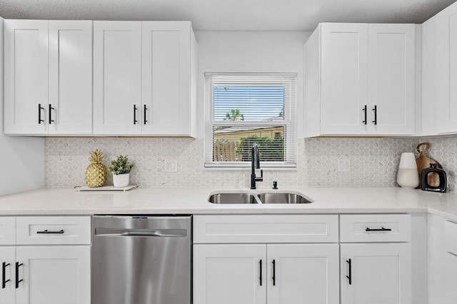 3029 Pinetree, Winter Haven, FL 33884 - kitchen featuring stainless steel dishwasher, white cabinetry, and light countertops