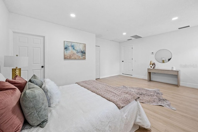 3029 Pinetree, Winter Haven, FL 33884 - bedroom with light wood-type flooring and recessed lighting