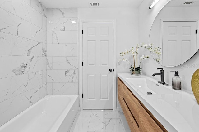 3029 Pinetree, Winter Haven, FL 33884 - full bathroom featuring vanity, marble finish floors, and shower / bathtub combination