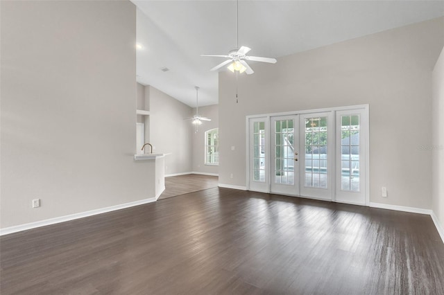 2675 Bond St, Clermont, FL 34711 - unfurnished living room with ceiling fan, dark wood-style floors, and high vaulted ceiling