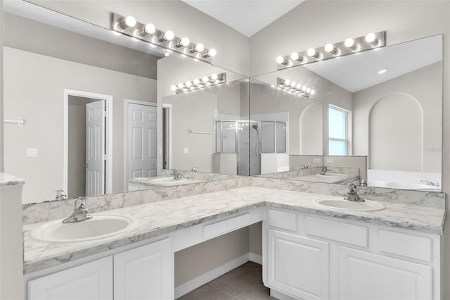 2675 Bond St, Clermont, FL 34711 - full bathroom featuring double vanity, a stall shower, tile patterned flooring, and a bathtub