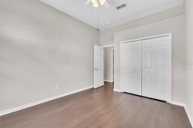 2675 Bond St, Clermont, FL 34711 - unfurnished bedroom with wood finished floors, a closet, and a ceiling fan